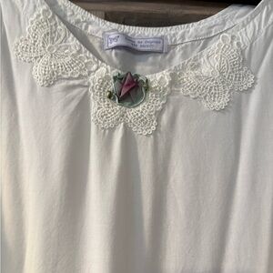 Elegant White Lace Trim nightgown Aline sharkbite hem. 26”across and 29” long